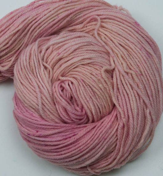 variegated light pink worsted weight cormo yarn