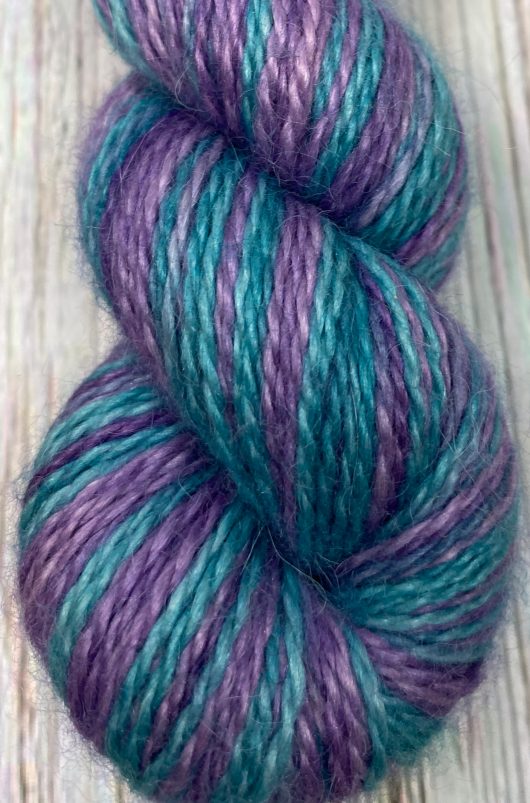 teal and purple skein