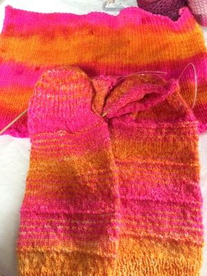 Socks from sock blank socks are striped in bright pink and orange