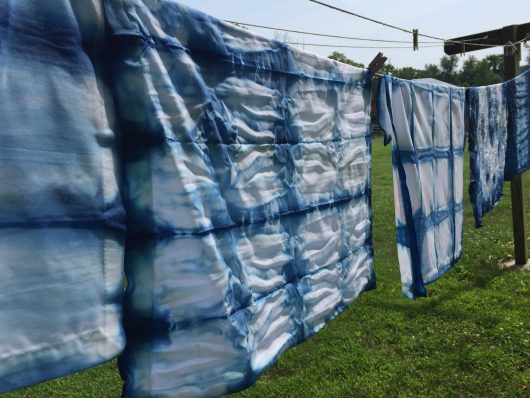 drying line with blue and white fabrics