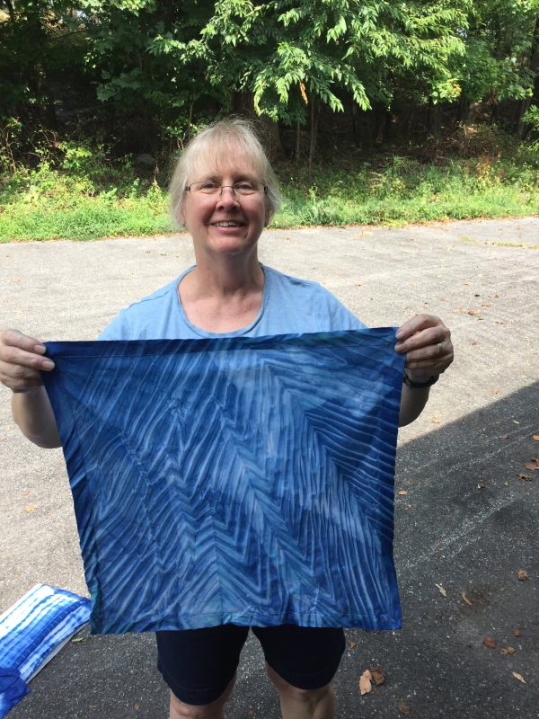 Student showing their shibori work