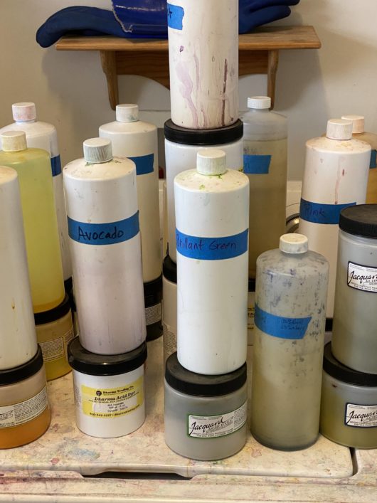 group of stock bottles and dye powders