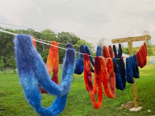 clothes line with yarn drying on it