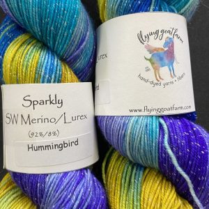 2 skeins of yarn in turquoise purple and ochre
