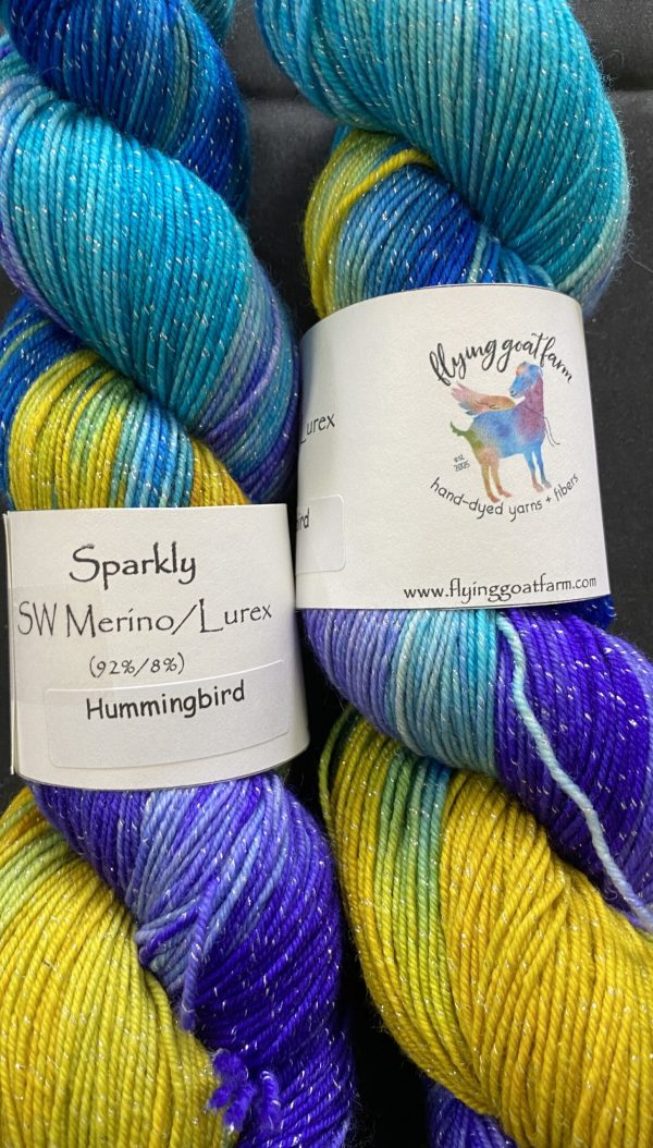 2 skeins of yarn in turquoise purple and ochre