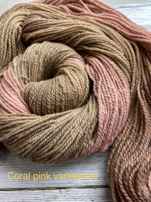 variegated medium brown and pink wool skein