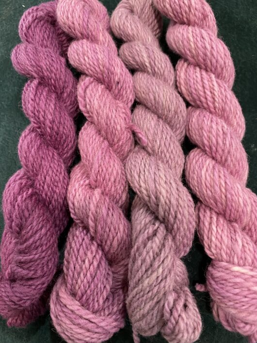 set of mini skeins in pinks and purples