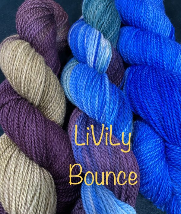 trio of wool skeins in blues, wine and green