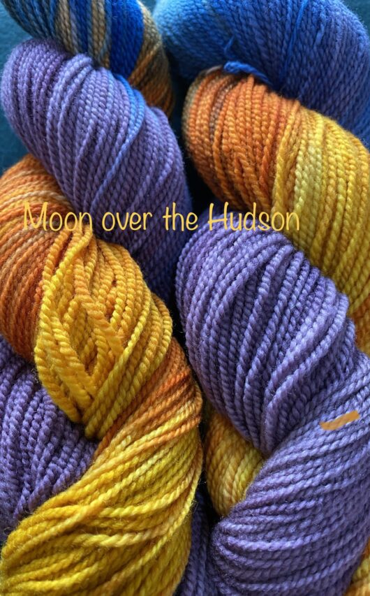 wool yarn with purple, orange and gold