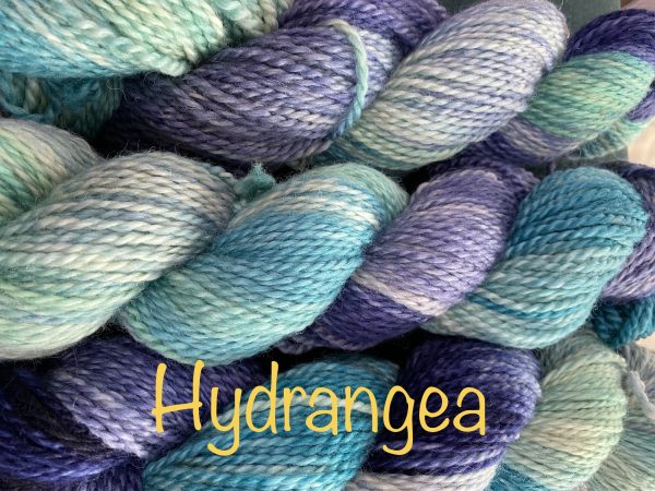 wool yarn in teal, purple and white