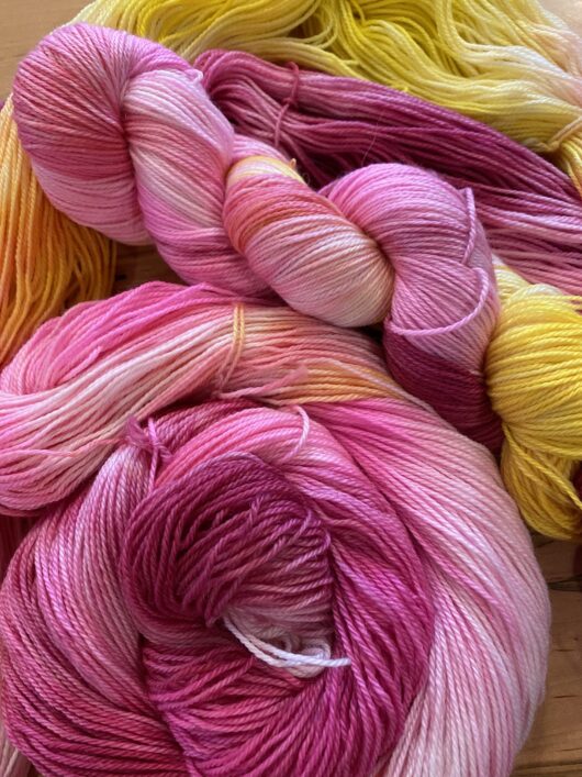 variegated yarn with pink, amethyst and yellow